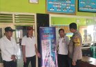 Bhabinkamtibmas Desa Bendungan Sosialisasikan Warga Melalui Pemasangan Spanduk Pengaduan Online Propam Polri